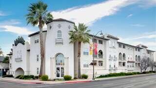 Gateway Santa Clara features a mid rise affordable housing community by EAH Housing with a modern exterior, clean lines, balconies, and landscaped courtyard in an urban neighborhood