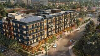 MiLA features a multi story affordable housing community by EAH Housing with contemporary design, rooftop features, and urban surroundings.