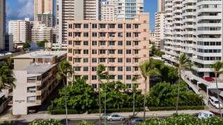Ainahau I, exterior view of affordable housing building with palm trees around, Honolulu, Hawai‘i.