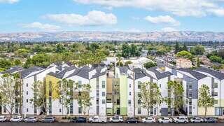 Art Ark Apartments exterior featuring a vibrant multi-story residential building designed for artists with bold architectural details.