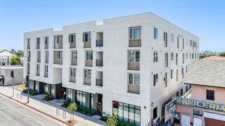 The Azalea features an affordable housing community by EAH Housing with a modern urban design, street-level amenities, and contemporary architecture in a vibrant city setting.