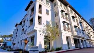 Water Street Apartments features an affordable housing community by EAH Housing with modern architecture, clean lines, and a pedestrian-friendly streetscape in an urban neighborhood.