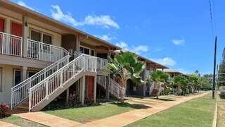 Waimea Haukaʻi features an affordable housing community by EAH Housing with a plantation-style design, open-air walkways, and a serene island setting.