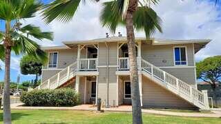 Kekuilani Gardens features a two story affordable housing community by EAH Housing with modern exterior, balconies, and landscaped grounds in a residential neighborhood