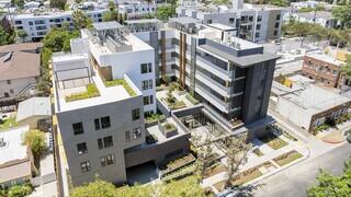 Marigold West features a multi story affordable housing community by EAH Housing with modern architecture, rooftop amenities, and landscaped courtyards in an urban neighborhood.
